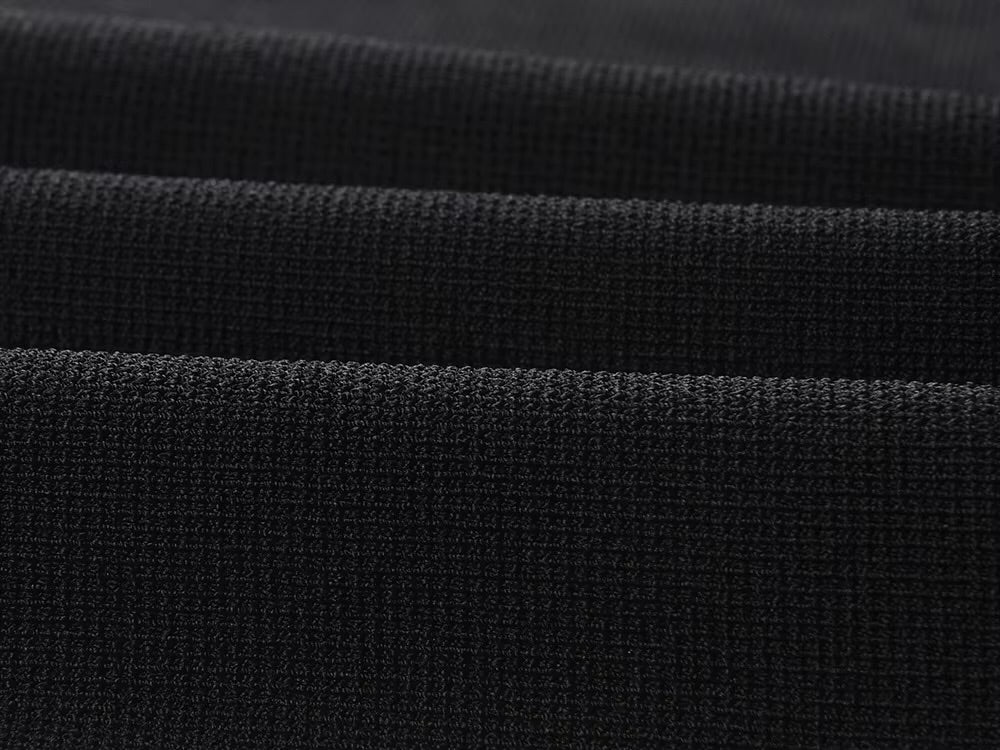 La Robe Parisienne — Knit Mini Dress in Black with White Pleated Hem