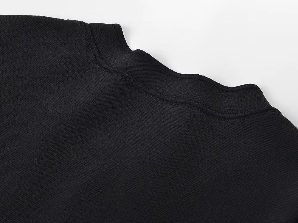 La Robe Parisienne — Knit Mini Dress in Black with White Pleated Hem